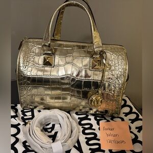 Micheal Kors Gold Crocodile Embossed Handbag. Crossbody strap included.